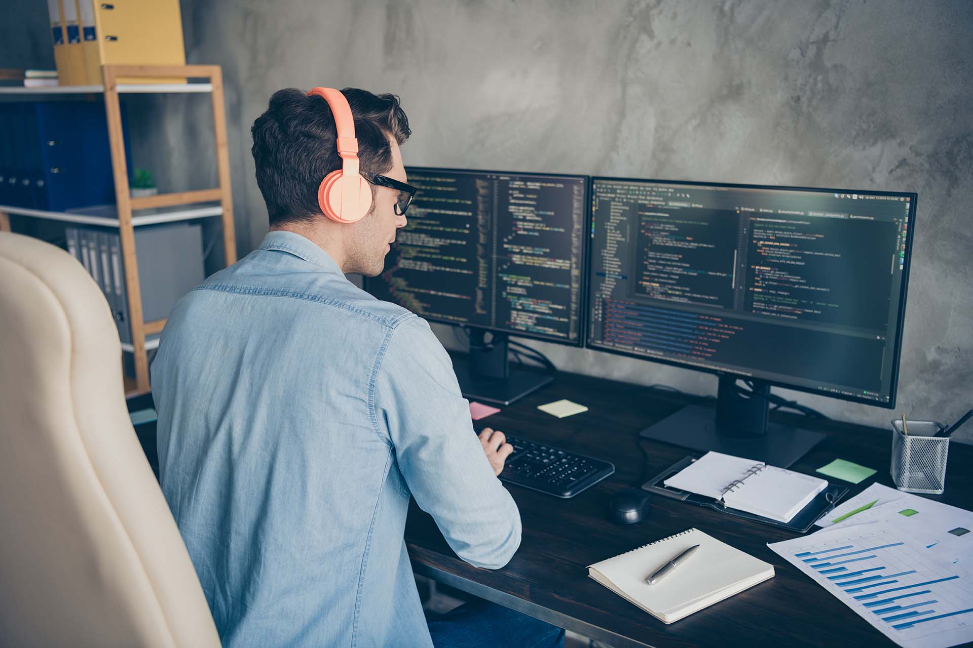 Rear back behind view portrait of his, he nice skilled busy geek guy typing php language C plus editing sql database source at modern industrial interior style concrete wall work place station