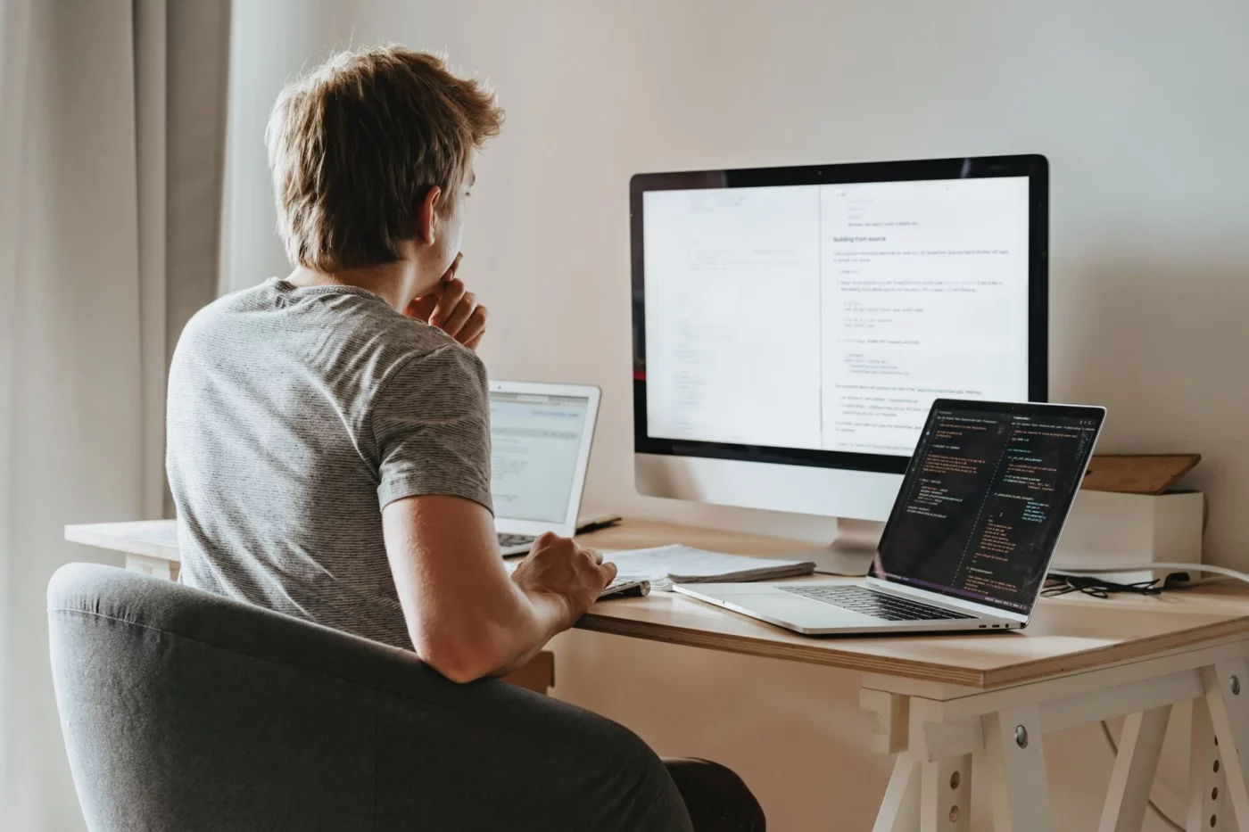 A man in front of computers