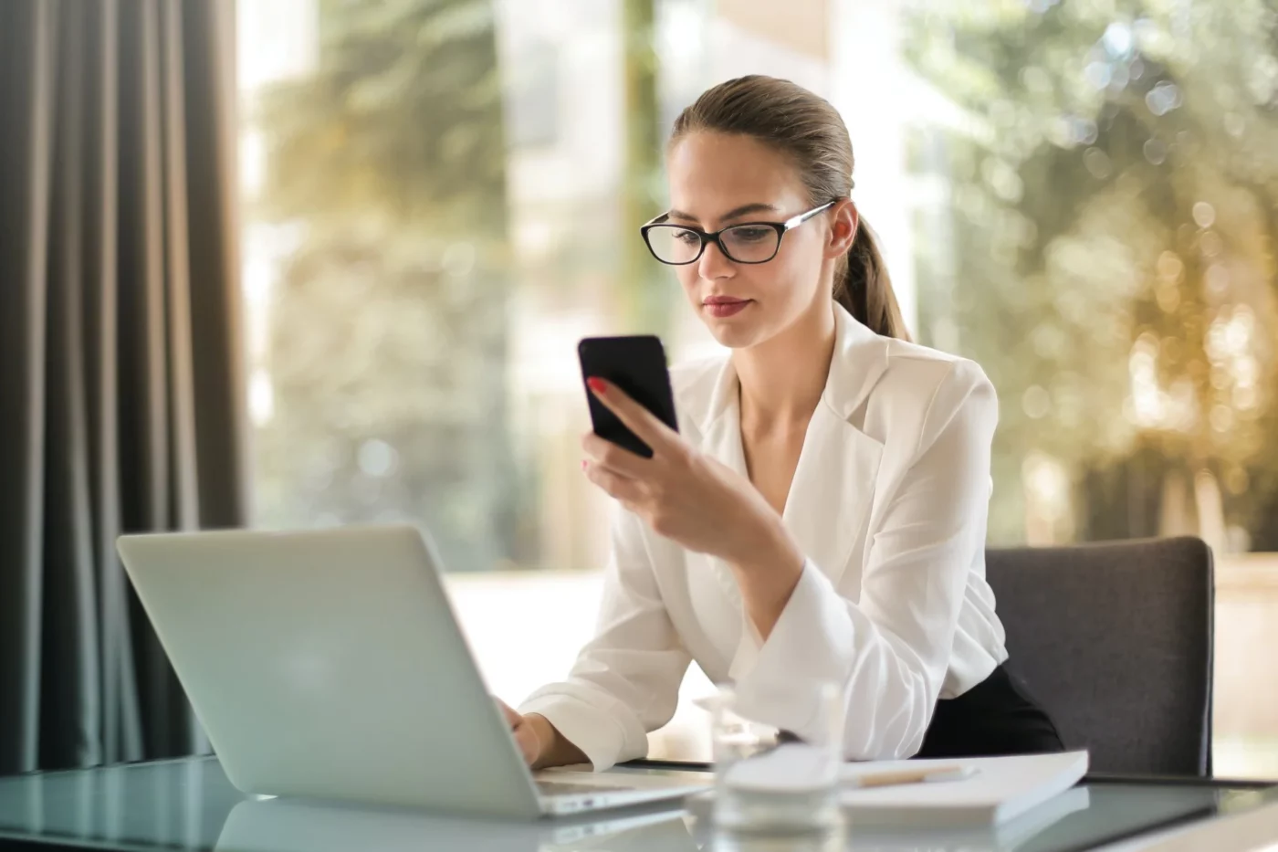 A woman looking at her phone