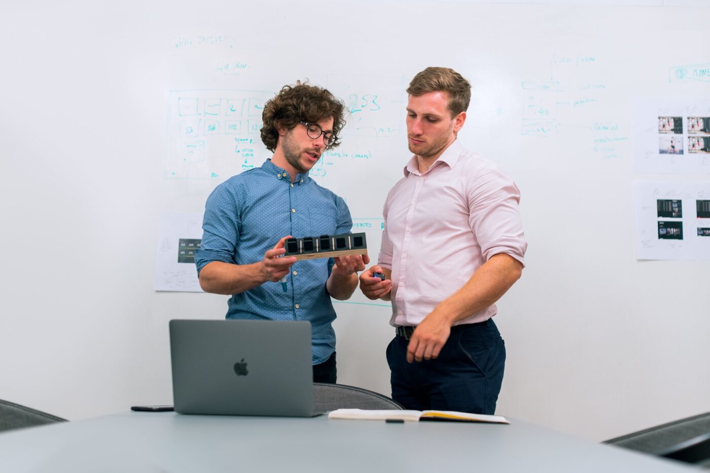 Two engineers discussing hardware prototyping