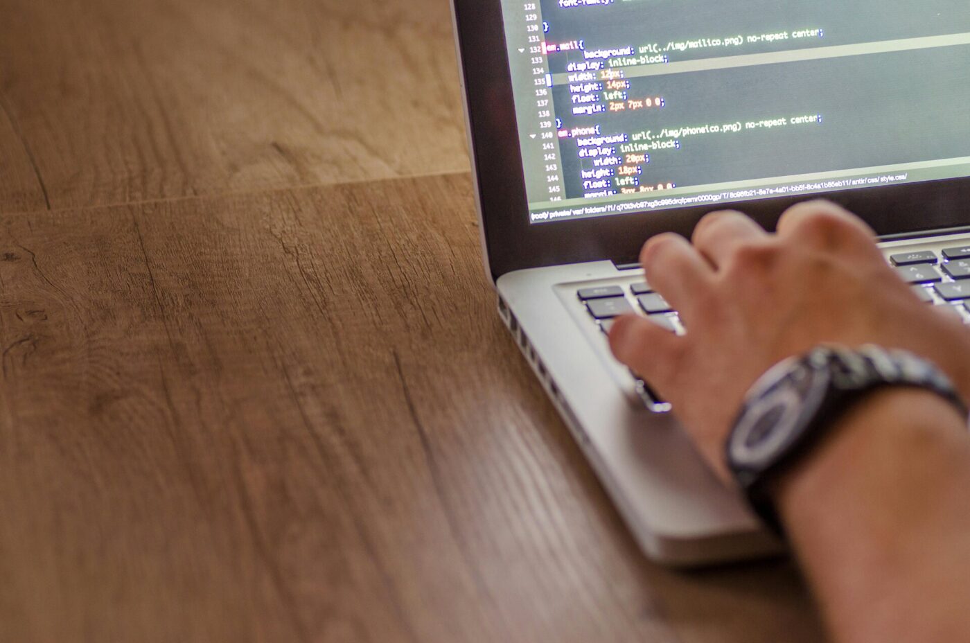 A developer working on a laptop