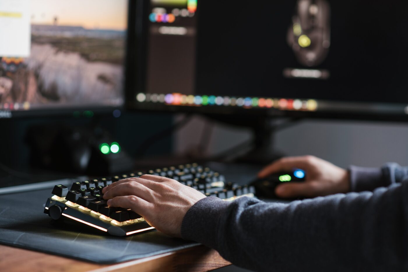 A man typing on a computer keyboard