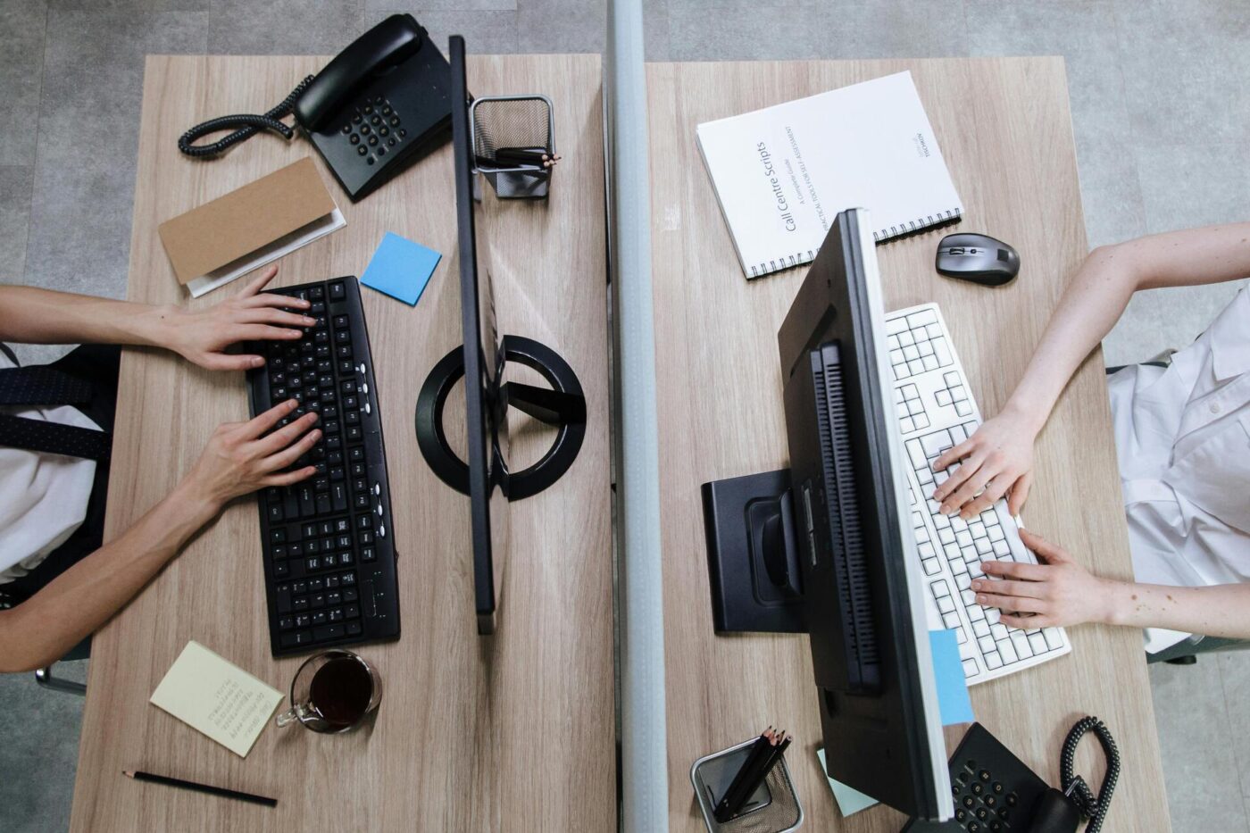 Two people working on computers