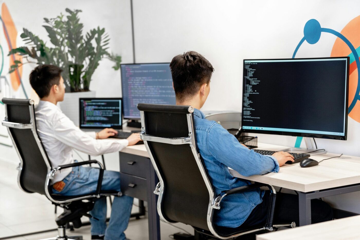 Two men programming in the office