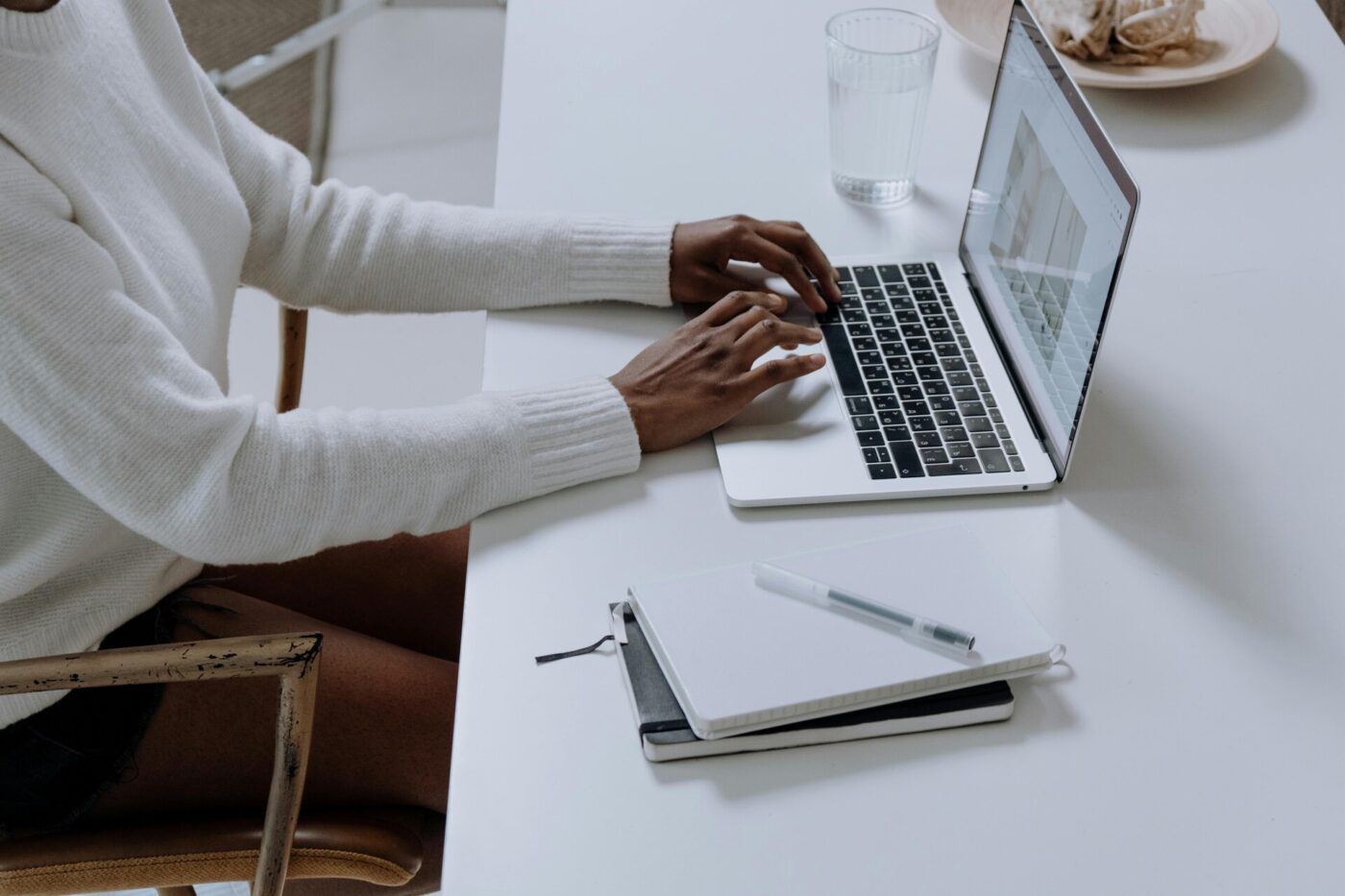 A person using a MacBook Pro computer