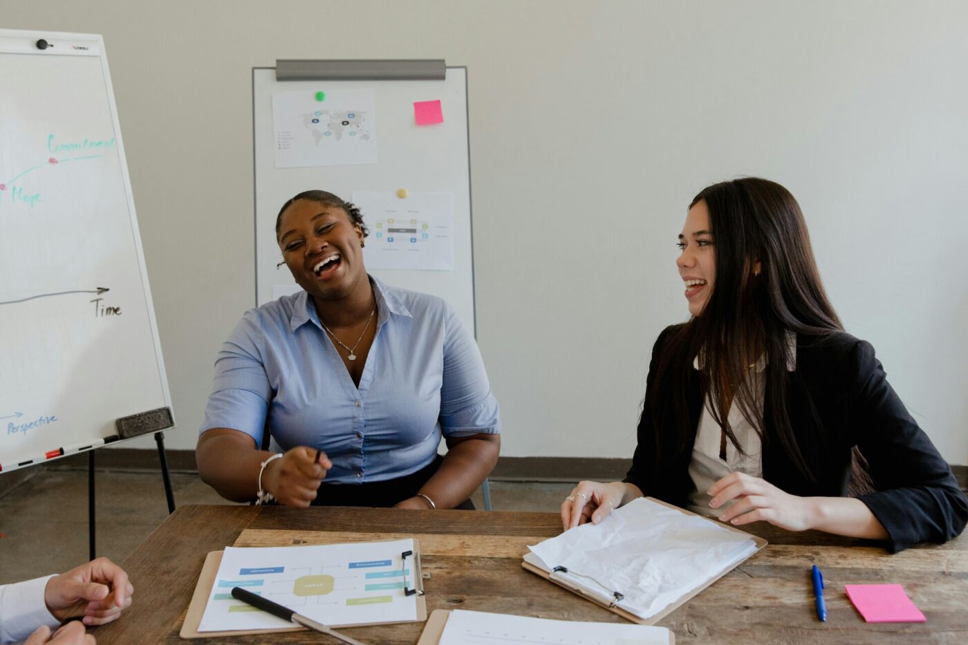 Two women smiling in the office